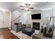 Bright and airy living room with wood floors, a fireplace, and stylish furnishings, perfect for entertaining at 847 Venture Sw Way, Atlanta, GA 30331