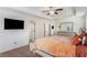 Bright main bedroom features a wall-mounted TV and ample space for relaxation at 847 Venture Sw Way, Atlanta, GA 30331