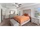 Spacious main bedroom features a large window, tray ceiling, and coordinated furniture at 847 Venture Sw Way, Atlanta, GA 30331