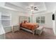 Comfortable main bedroom boasts a tray ceiling, fan, and soft, neutral decor at 847 Venture Sw Way, Atlanta, GA 30331
