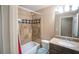 Traditional bathroom with tub/shower combo, granite countertops, and neutral color scheme at 1137 Fortress Sw Ave, Atlanta, GA 30315