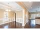 Bright dining room with elegant chandelier, decorative trim, and hardwood floors at 1137 Fortress Sw Ave, Atlanta, GA 30315