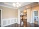 Bright dining room with elegant chandelier, decorative trim, and hardwood floors at 1137 Fortress Sw Ave, Atlanta, GA 30315
