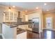 Modern kitchen featuring stainless steel appliances, granite countertops, and stylish backsplash at 1137 Fortress Sw Ave, Atlanta, GA 30315