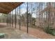 Back porch overlooks large wooded backyard surrounded by mature trees offering great shade at 2205 Parliament Dr, Lawrenceville, GA 30043
