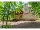 Backyard featuring a well-maintained lawn and the rear of the two-story home at 2205 Parliament Dr, Lawrenceville, GA 30043