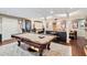 Basement billiards room includes a pool table, seating area and an entertainment area with a large screen at 2205 Parliament Dr, Lawrenceville, GA 30043