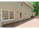 A long wooden deck extends from the house, perfect for outdoor relaxation at 2205 Parliament Dr, Lawrenceville, GA 30043