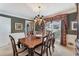 Formal dining room features a large table, stylish lighting, and classic decor at 2205 Parliament Dr, Lawrenceville, GA 30043