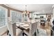 Open dining room with views of the kitchen and backyard at 2205 Parliament Dr, Lawrenceville, GA 30043