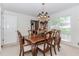 Traditional dining room features a wood table, six chairs, and a decorative chandelier at 2205 Parliament Dr, Lawrenceville, GA 30043