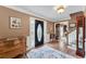 Traditional foyer with a decorative rug, beautiful hardwood floors, and a leaded glass front door at 2205 Parliament Dr, Lawrenceville, GA 30043