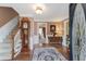 Inviting foyer with hardwood floors, a staircase, and a classic grandfather clock at 2205 Parliament Dr, Lawrenceville, GA 30043