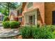 Close-up view of the front door with ornate trim and well-maintained landscaping at 2205 Parliament Dr, Lawrenceville, GA 30043