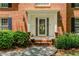 Elegant entrance with a decorative front door and classic brick facade at 2205 Parliament Dr, Lawrenceville, GA 30043