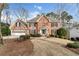 Charming two-story brick home with a well-manicured lawn and a two-car garage at 2205 Parliament Dr, Lawrenceville, GA 30043