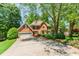Traditional brick home featuring an attached garage and landscaped front yard at 2205 Parliament Dr, Lawrenceville, GA 30043
