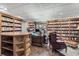 Spacious home library with bookshelves, a desk, and ample seating at 2205 Parliament Dr, Lawrenceville, GA 30043