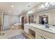 Main bathroom featuring double vanity, a soaking tub, and tiled floors at 2205 Parliament Dr, Lawrenceville, GA 30043
