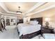 Main bedroom featuring a king bed, bedside tables, and ensuite bathroom at 2205 Parliament Dr, Lawrenceville, GA 30043