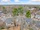 Aerial view of a neighborhood featuring multiple homes, mature trees, and surrounding community at 2692 Glenrose Hl, Atlanta, GA 30341
