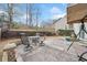 Backyard patio with chairs and table, plus a covered swing to enjoy the shade at 2692 Glenrose Hl, Atlanta, GA 30341