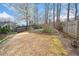 Spacious fenced backyard with a slight hill and landscaped perimeter, a perfect space for outdoor activities at 2692 Glenrose Hl, Atlanta, GA 30341