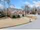 Charming brick home with a well-manicured lawn, mature trees, and a driveway at 2692 Glenrose Hl, Atlanta, GA 30341