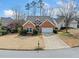 Charming brick home featuring a two-car garage, manicured lawn, and traditional architectural details at 2692 Glenrose Hl, Atlanta, GA 30341