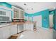 Well-lit kitchen with white cabinets, stainless steel appliances, and decorative pendant lighting at 2692 Glenrose Hl, Atlanta, GA 30341