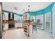 Bright kitchen with white cabinets, black backsplash, and a breakfast bar area at 2692 Glenrose Hl, Atlanta, GA 30341