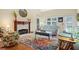 Cozy living room with a fireplace, comfortable seating, and a colorful rug at 2692 Glenrose Hl, Atlanta, GA 30341