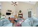 Inviting living room with vaulted ceiling, fireplace, hardwood floors, and stylish furnishings at 2692 Glenrose Hl, Atlanta, GA 30341