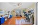 Large office with hardwood floors, a ceiling fan, two desks, and natural light from the big window at 2692 Glenrose Hl, Atlanta, GA 30341