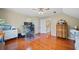 Upstairs office featuring hardwood floors, a ceiling fan, desk, and a view of the hallway at 2692 Glenrose Hl, Atlanta, GA 30341