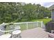 Inviting back deck with outdoor seating overlooking a lush green lawn at 4090 Mark Todd Ct, Hoschton, GA 30548