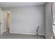 Bright bedroom with neutral carpet, paint, window, and plenty of natural light at 4090 Mark Todd Ct, Hoschton, GA 30548