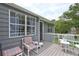 Charming outdoor deck area with seating and a well-maintained exterior, perfect for relaxation and entertaining at 4090 Mark Todd Ct, Hoschton, GA 30548
