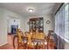 Formal dining room showcasing a wooden table set and classic china cabinet near a fireplace at 4090 Mark Todd Ct, Hoschton, GA 30548