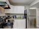 Kitchen featuring stainless steel appliances, granite countertops, and white cabinets at 4090 Mark Todd Ct, Hoschton, GA 30548