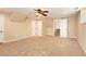 Finished basement with neutral carpet, ceiling fan, and access to staircase at 1736 Inas Way, Tucker, GA 30084