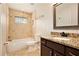 Bathroom with tiled shower and granite countertops at 1736 Inas Way, Tucker, GA 30084
