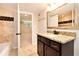 Bathroom features a shower and granite countertops at 1736 Inas Way, Tucker, GA 30084