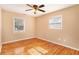 Bedroom features hardwood floors and windows at 1736 Inas Way, Tucker, GA 30084