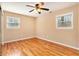 Bedroom features hardwood floors and windows at 1736 Inas Way, Tucker, GA 30084