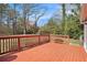 Exterior deck features wooden planks, red railing, and a peaceful, wooded backdrop at 1736 Inas Way, Tucker, GA 30084