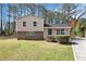 Charming split-level home featuring a well-maintained front yard and driveway at 1736 Inas Way, Tucker, GA 30084