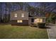 Charming split-level home featuring a well-maintained front yard and driveway at 1736 Inas Way, Tucker, GA 30084