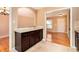 Open floorplan features a kitchen with granite countertops and dark cabinets at 1736 Inas Way, Tucker, GA 30084
