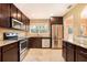 Modern kitchen with stainless steel appliances and granite countertops at 1736 Inas Way, Tucker, GA 30084